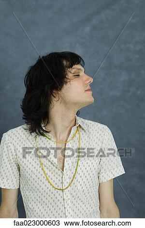 Teenage boy with eyes half-opened, sideways glance View Large Photo Image Stock Image - Teenage boy with eyes half-opened, sideways glance. Fotosearch