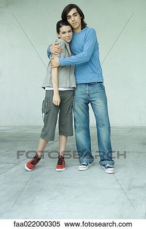 Teenage couple, full length portrait View Large Photo Image Stock Photography - Teenage couple, full length portrait. Fotosearch