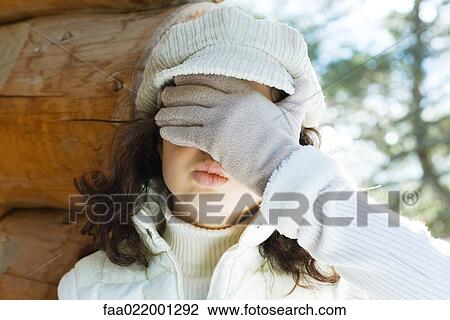 Teenage girl covering eyes and puckering lips, close-up View Large Photo Image Stock Image - Teenage girl covering eyes and puckering lips, close-up. Fotosearch