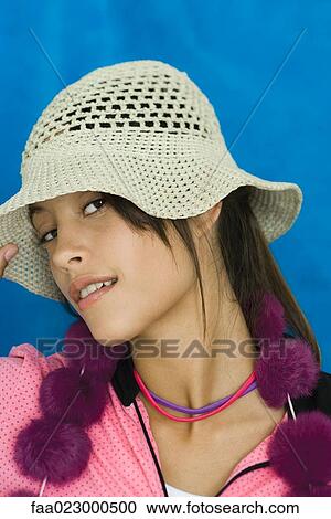 Teenage girl looking at camera, sideways glance, portrait View Large Photo Image Stock Image - Teenage girl looking at camera, sideways glance, portrait. Fotosearch