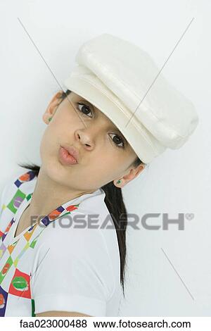Teenage girl looking at camera, puckering lips, portrait View Large Photo Image Stock Photo - Teenage girl looking at camera, puckering lips, portrait. Fotosearch