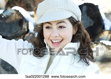 Stock Photo - Teenage girl, looking away, smiling. Fotosearch