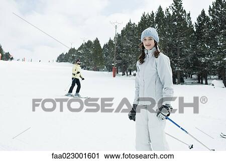 Teenage girl on skis, smiling at camera View Large Photo Image Stock Image - Teenage girl on skis, smiling at camera. Fotosearch