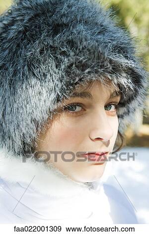 Teenage girl wearing fur hat, close-up portrait View Large Photo Image Stock Photo - Teenage girl wearing fur hat, close-up portrait. Fotosearch
