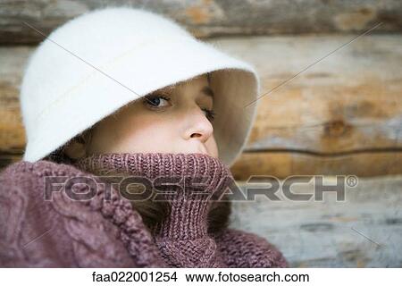 Picture - Teenage girl wearing hat and turtleneck, close-up, portrait. Fotosearch