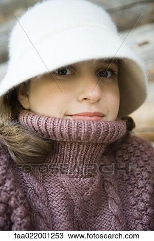 Teenage girl wearing hat and turtleneck, close-up, portrait View Large Photo Image Stock Image - Teenage girl wearing hat and turtleneck, close-up, portrait. Fotosearch