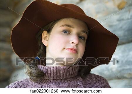Teenage girl wearing turtleneck and hat, portrait View Large Photo Image Stock Image - Teenage girl wearing turtleneck and hat, portrait. Fotosearch