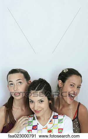 Three young female friends, head and shoulders, portrait View Large Photo Image Stock Image - Three young female friends, head and shoulders, portrait. Fotosearch