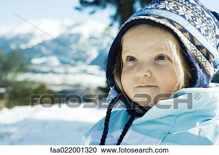 Toddler girl wearing winter clothes in snowy landscape, portrait View Large Photo Image Stock Image - Toddler girl wearing winter clothes in snowy landscape, portrait. Fotosearch