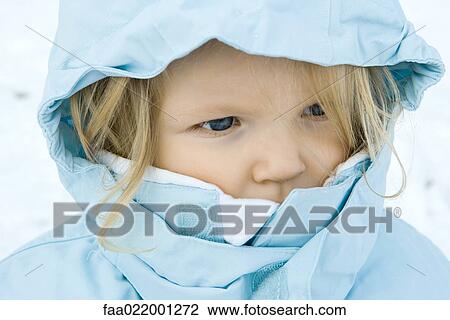 Stock Image - Toddler girl wearing winter coat, close-up, portrait. Fotosearch