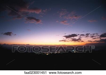 Town illuminated in distant valley at twilight View Large Photo Image Stock Image - Town illuminated in distant valley at twilight. Fotosearch
