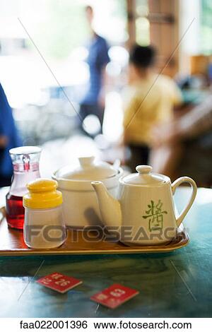 Tray with tea service and table markers on table in restaurant View Large Photo Image Stock Photograph - Tray with tea service and table markers on table in restaurant. Fotosearch