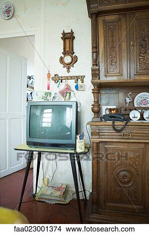 Picture - TV next to china cabinet in living room. Fotosearch