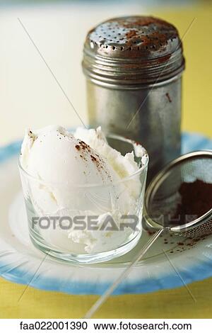 Vanilla ice cream with cocoa powder sprinkled on top, next to shaker and sieve View Large Photo Image Stock Image - Vanilla ice cream with cocoa powder sprinkled on top, next to shaker and sieve. Fotosearch