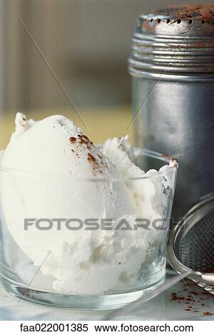 Vanilla ice cream with cocoa powder sprinkled on top, next to shaker and sieve View Large Photo Image Stock Photography - Vanilla ice cream with cocoa powder sprinkled on top, next to shaker and sieve. Fotosearch