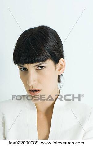 Woman frowning at camera, portrait View Large Photo Image Stock Photo - Woman frowning at camera, portrait. Fotosearch