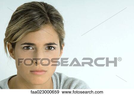 Stock Photo - Woman glaring at camera, portrait. Fotosearch