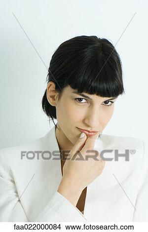 Woman, holding chin, looking at camera, portrait View Large Photo Image Picture - Woman, holding chin, looking at camera, portrait. Fotosearch