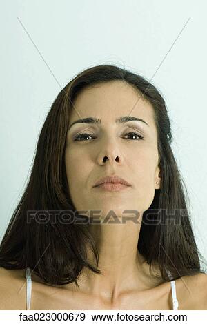 Woman looking down nose at camera, portrait View Large Photo Image Stock Photo - Woman looking down nose at camera, portrait. Fotosearch