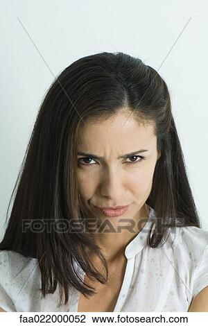 Woman pouting, looking at camera, portrait View Large Photo Image Stock Image - Woman pouting, looking at camera, portrait. Fotosearch