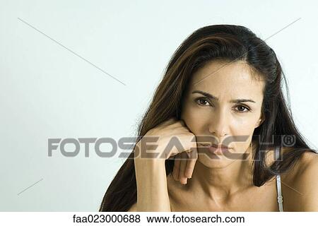 Woman pouting, looking at camera, portrait View Large Photo Image Stock Photo - Woman pouting, looking at camera, portrait. Fotosearch