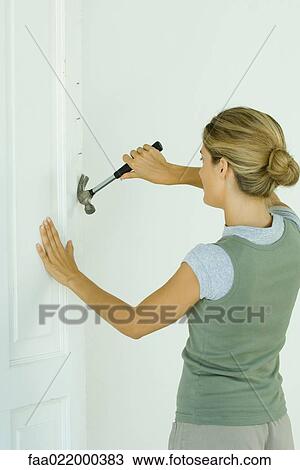 Woman removing nails with hammer View Large Photo Image Stock Image - Woman removing nails with hammer. Fotosearch
