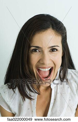 Woman, smiling at camera, mouth wide open, portrait View Large Photo Image Stock Photo - Woman, smiling at camera, mouth wide open, portrait. Fotosearch