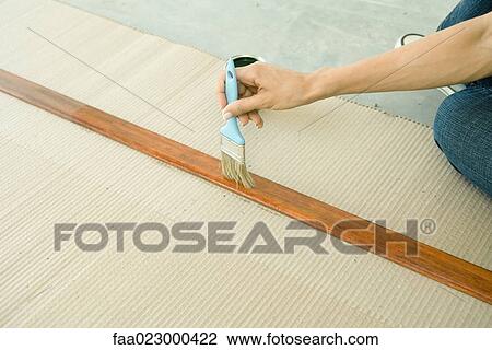 Woman staining piece of wood, cropped view of arm View Large Photo Image Stock Image - Woman staining piece of wood, cropped view of arm. Fotosearch