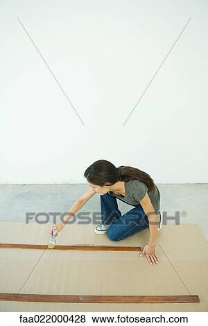 Woman staining slats of wood View Large Photo Image Stock Photo - Woman staining slats of wood. Fotosearch