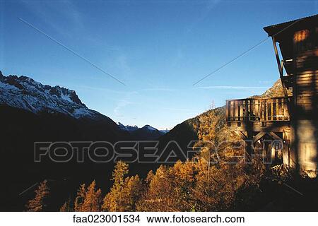 Picture - Wood cabin in mountainous setting. Fotosearch