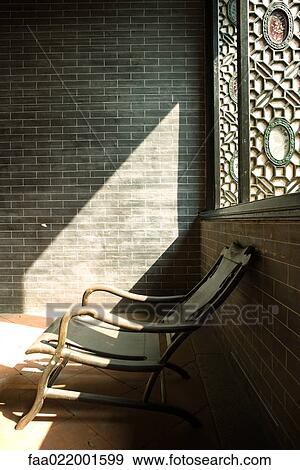 Wooden chair near window, in sun View Large Photo Image Stock Photo - Wooden chair near window, in sun. Fotosearch