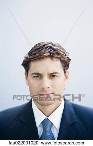 Young businessman looking at camera, portrait, head and shoulders View Large Photo Image Stock Image - Young businessman looking at camera, portrait, head and shoulders. Fotosearch