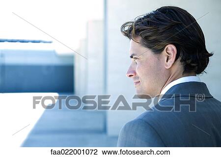 Young businessman looking away, profile, head and shoulders View Large Photo Image Stock Image - Young businessman looking away, profile, head and shoulders. Fotosearch