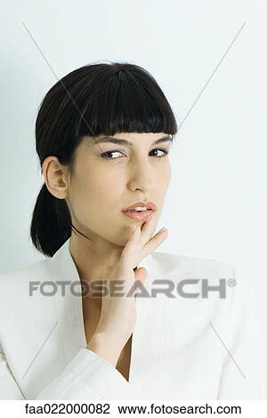 Young businesswoman, looking away, hand by chin, portrait View Large Photo Image Stock Image - Young businesswoman, looking away, hand by chin, portrait. Fotosearch