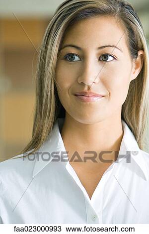 Young businesswoman looking away, smiling, portrait View Large Photo Image Stock Image - Young businesswoman looking away, smiling, portrait. Fotosearch