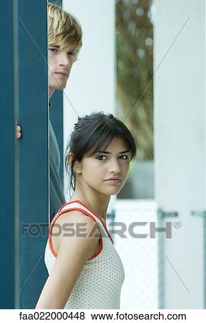 Young couple, woman looking at camera View Large Photo Image Stock Photo - Young couple, woman looking at camera. Fotosearch