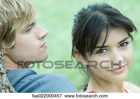 Young couple, woman smiling at camera, portrait View Large Photo Image Stock Photo - Young couple, woman smiling at camera, portrait. Fotosearch