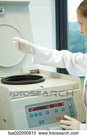 Young female researcher using centrifuge in laboratory, partial view View Large Photo Image Stock Photography - Young female researcher using centrifuge in laboratory, partial view. Fotosearch