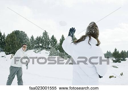 Young friends having snowball fight View Large Photo Image Stock Photography - Young friends having snowball fight. Fotosearch