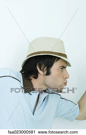 Young man making faces, profile, portrait View Large Photo Image Stock Image - Young man making faces, profile, portrait. Fotosearch