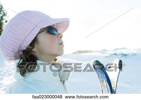 Young skier wearing cap, looking away, profile View Large Photo Image Stock Photo - Young skier wearing cap, looking away, profile. Fotosearch