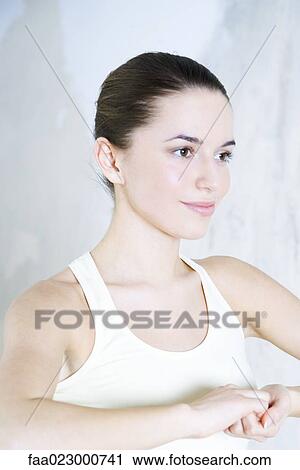 Young woman doing yoga pose, clasped hands, smiling, head and shoulders View Large Photo Image Stock Image - Young woman doing yoga pose, clasped hands, smiling, head and shoulders. Fotosearch