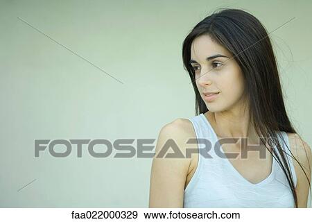Young woman, looking away, head and shoulders, portrait View Large Photo Image Stock Photo - Young woman, looking away, head and shoulders, portrait. Fotosearch