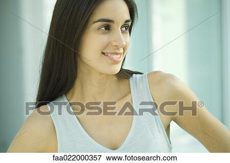 Young woman, looking away, head and shoulders, portrait View Large Photo Image Stock Photo - Young woman, looking away, head and shoulders, portrait. Fotosearch