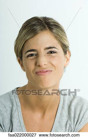 Young woman making face, portrait View Large Photo Image Stock Photo - Young woman making face, portrait. Fotosearch