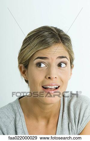 Young woman making surprised face, portrait View Large Photo Image Stock Photo - Young woman making surprised face, portrait. Fotosearch