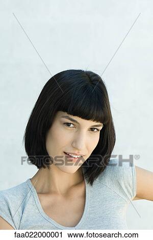 Young woman, smiling at camera, portrait View Large Photo Image Stock Image - Young woman, smiling at camera, portrait. Fotosearch