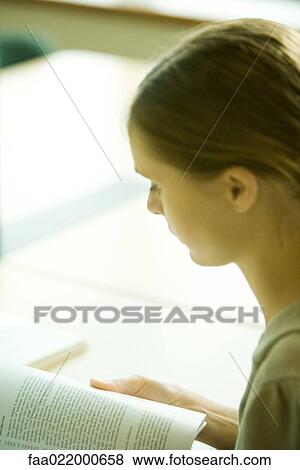 Young woman studying, close-up View Large Photo Image Stock Photo - Young woman studying, close-up. Fotosearch