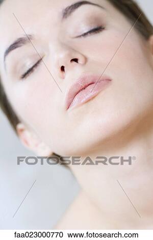Young woman with eyes closed, head back, portrait View Large Photo Image Stock Image - Young woman with eyes closed, head back, portrait. Fotosearch