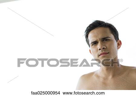 Barechested young man, looking at camera, head and shoulders View Large Photo Image Picture - Barechested young man, looking at camera, head and shoulders. Fotosearch